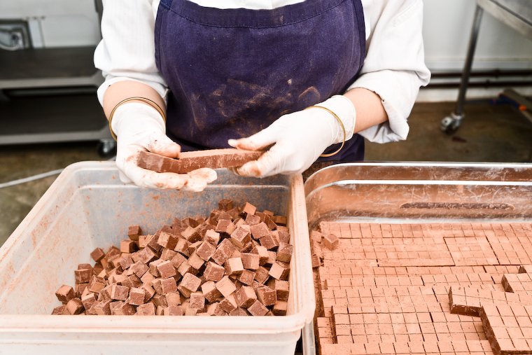 Separating chocolate truffles.