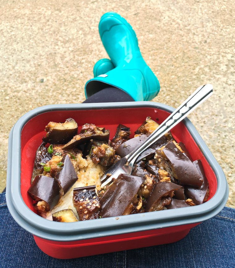 Me, my beloved rain boots and my collapsible lunch container, eating eggplant at the park.
